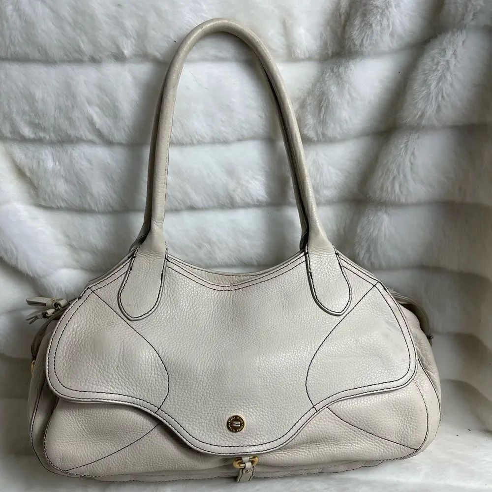 Cole Haan pebble leather beige hobo shoulder bag with gold tone hardwares.